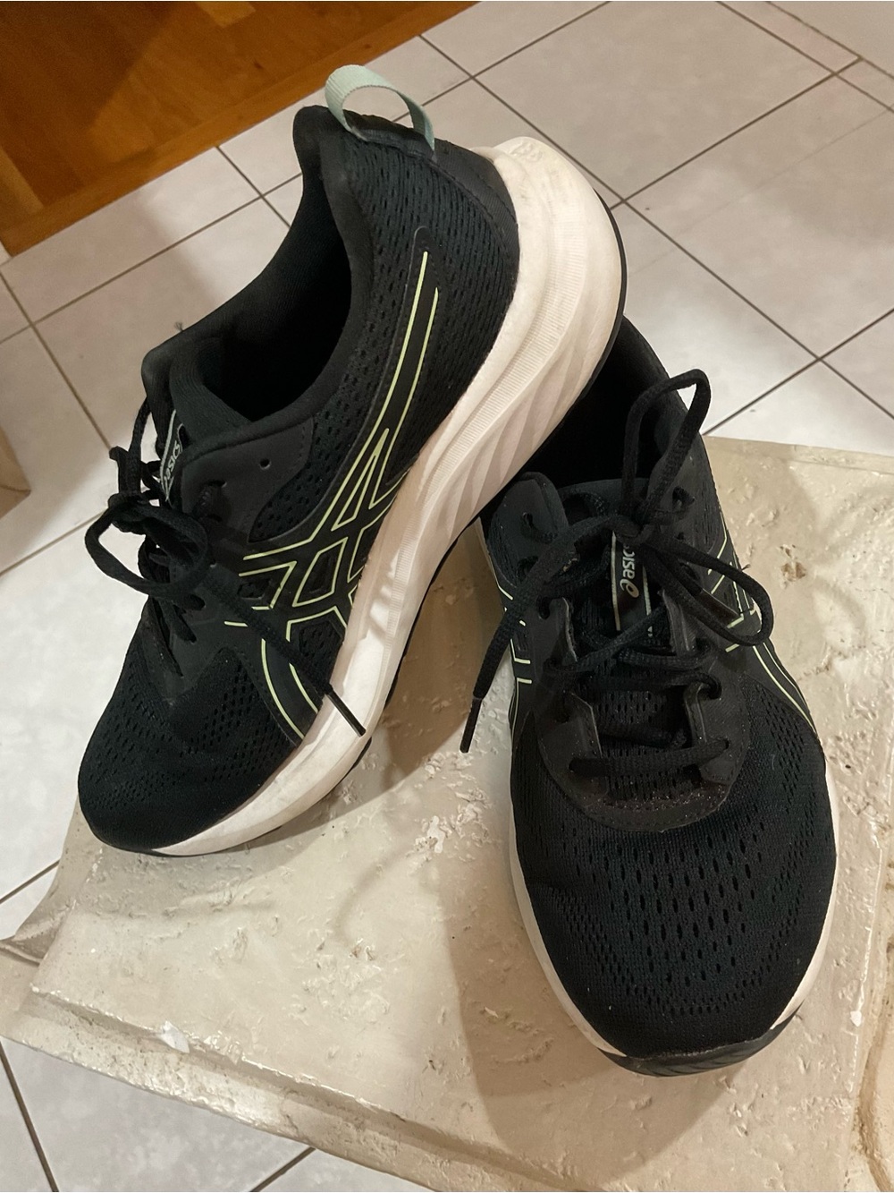 ASICS women’s Black Sneakers with Neon pale green Accents